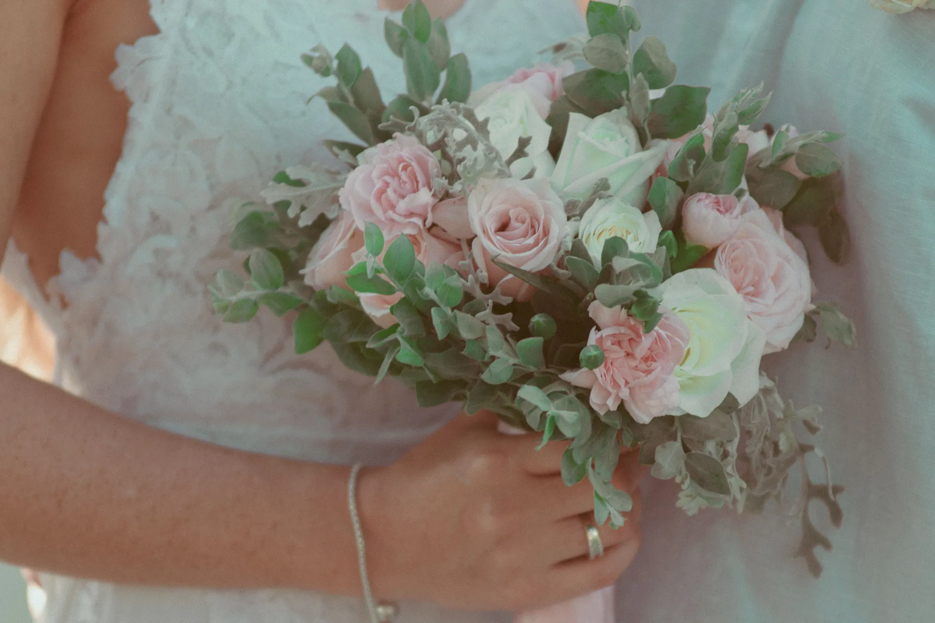 Bridal bouquet of pink and white roses at an intimate Bali wedding